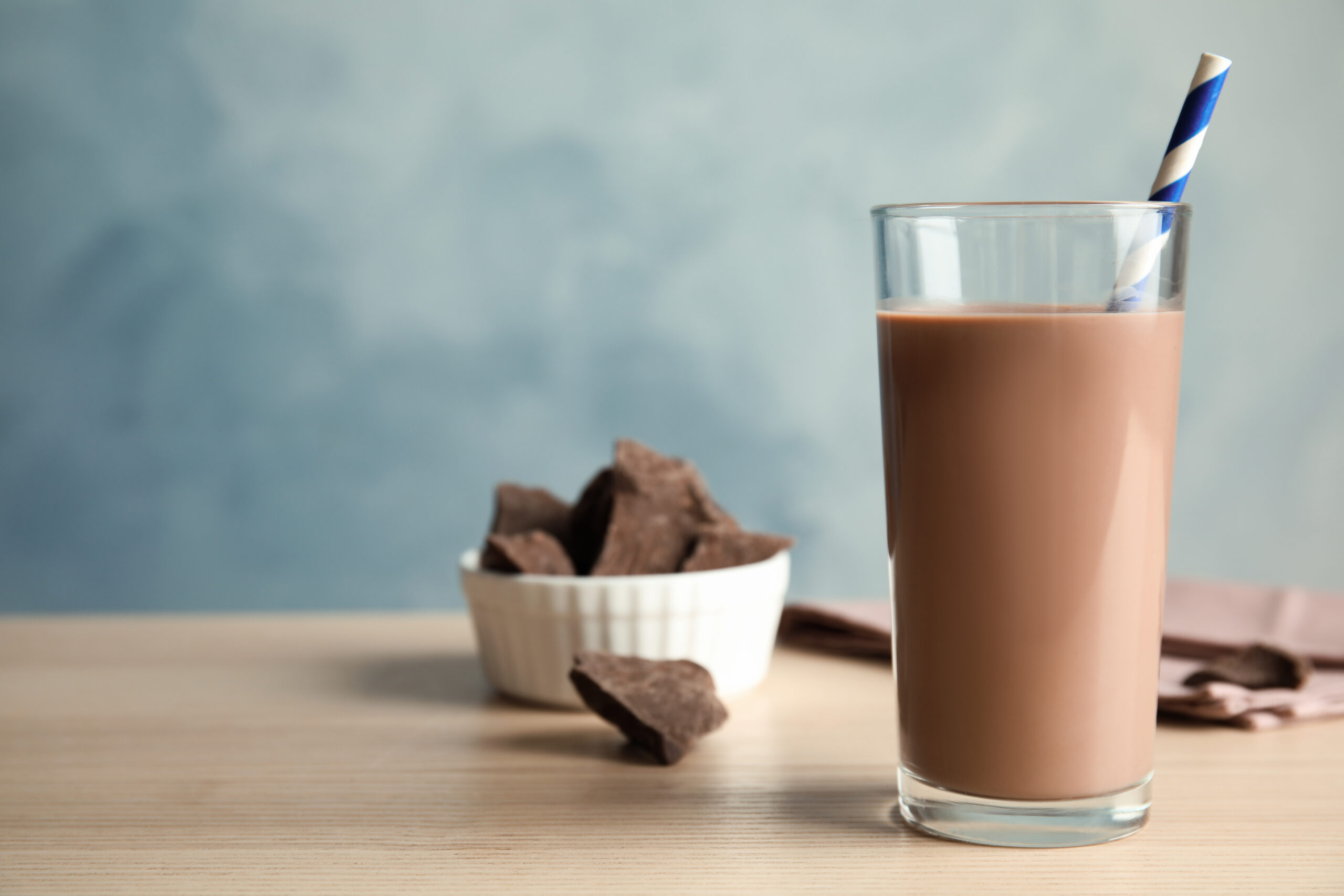 Glass,Of,Tasty,Chocolate,Milk,On,Wooden,Table,,Space,For
